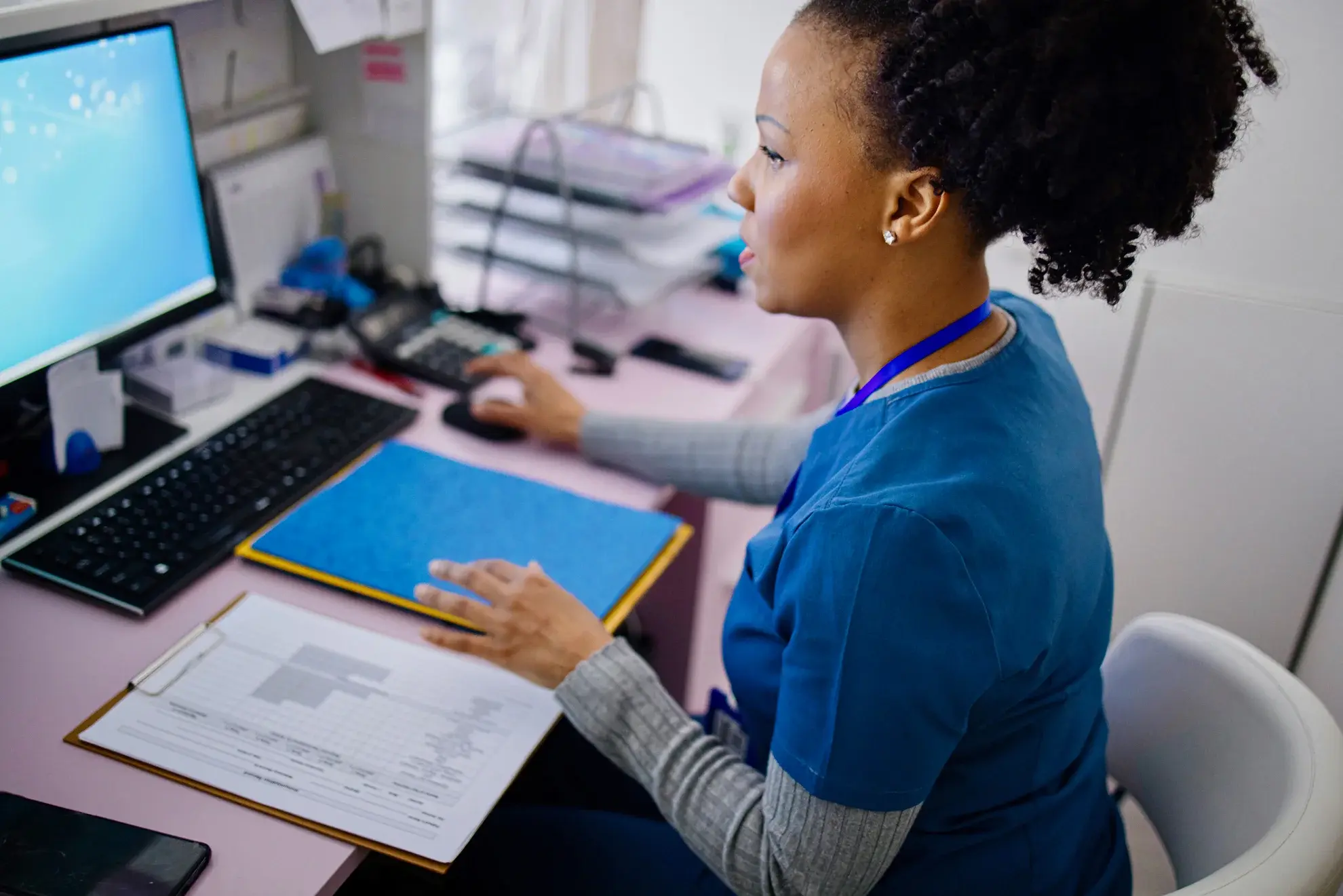 clinician working in doctor office
